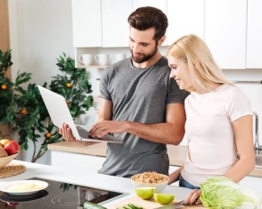 happy-young-loving-couple-standing-kitchen-cooking.jpg